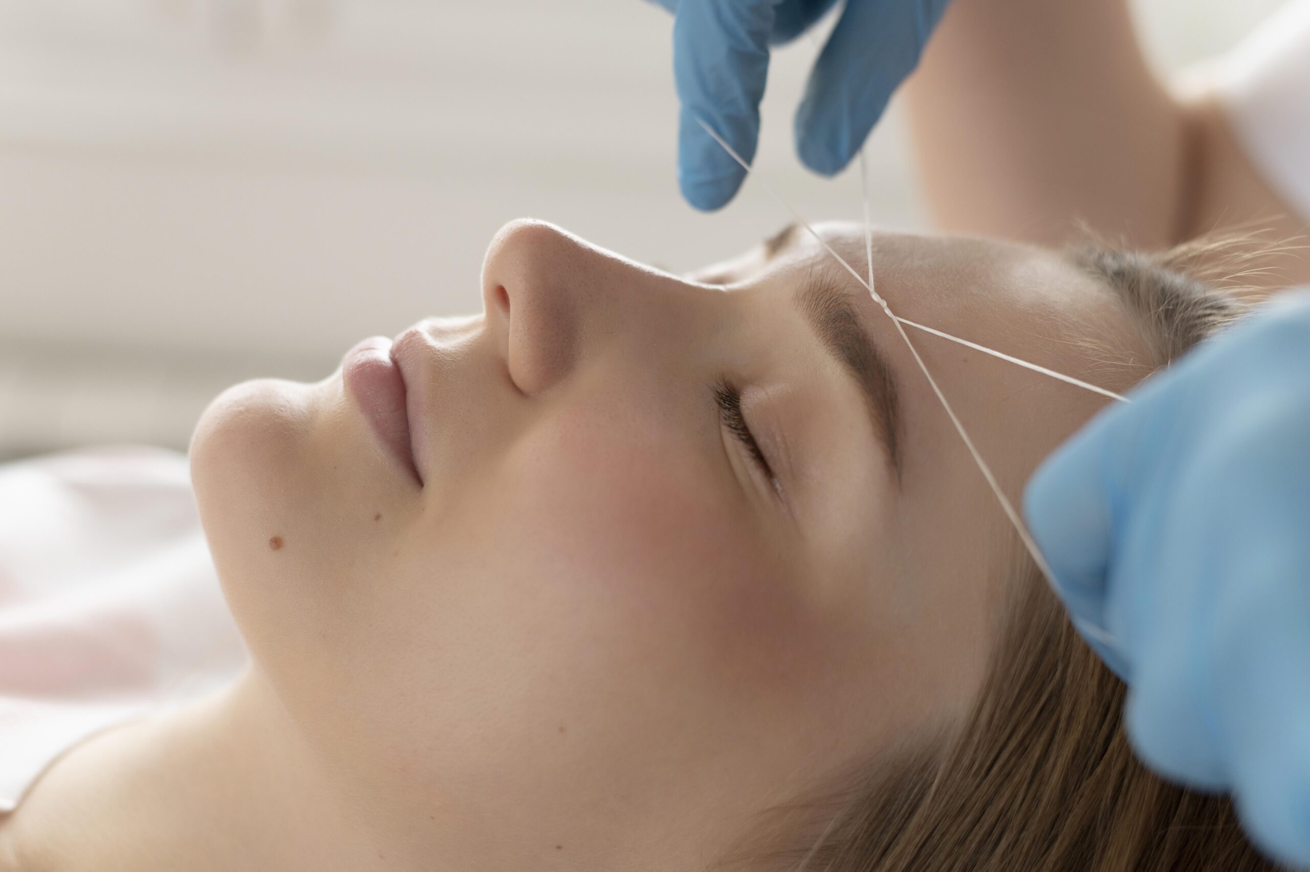 close-up-young-woman-getting-eyebrow-treatment (1)