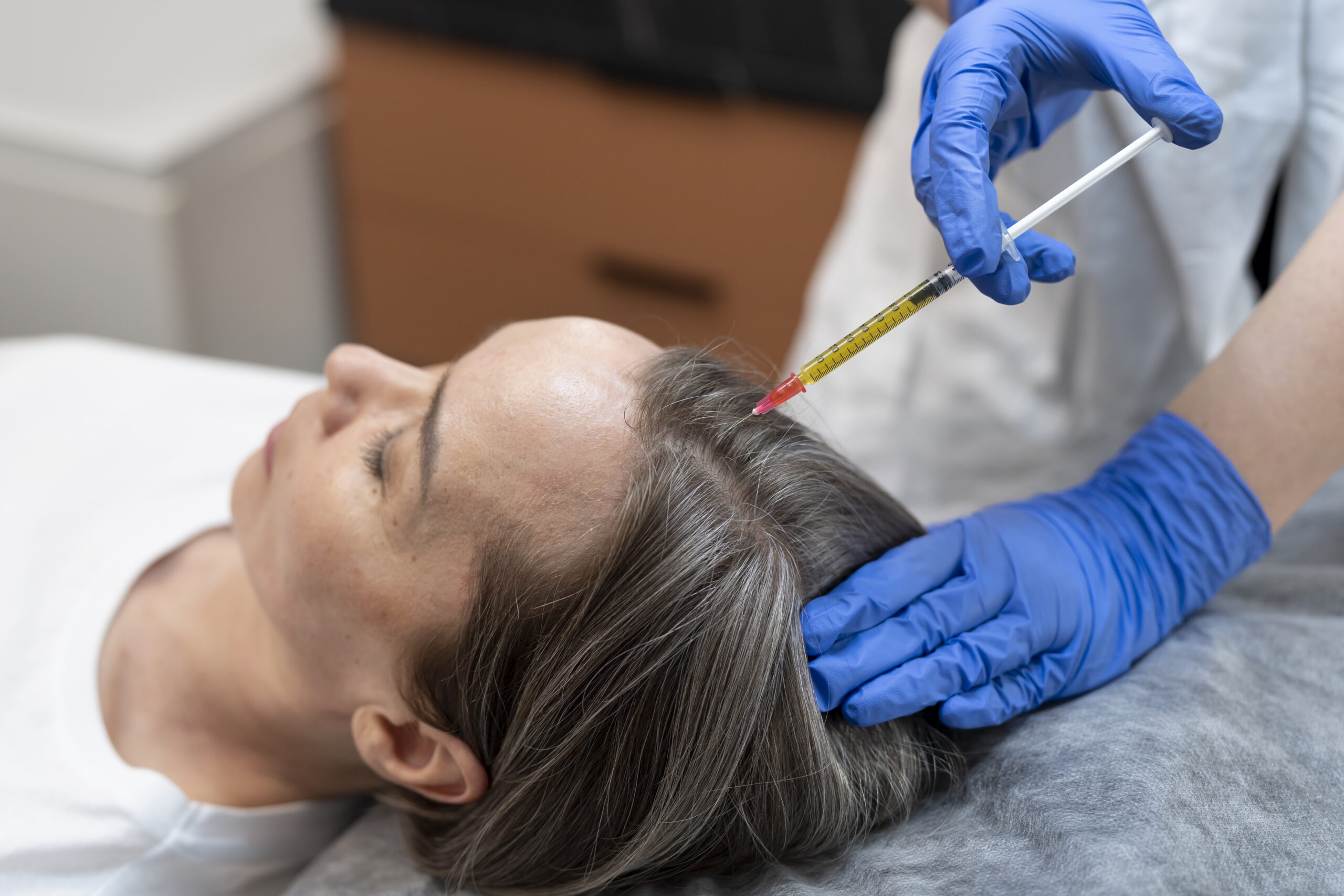 high-angle-patient-getting-prp-injection-alopecia